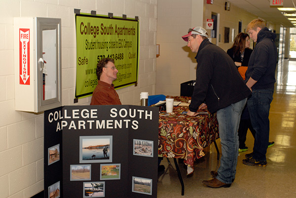 While Williamsport landlords set up shop at an Off-Campus Housing Expo in the Madigan Library, Charlie Lowry of College South Apartments spotlights his Montgomery-area rental properties for students in ESC majors.
