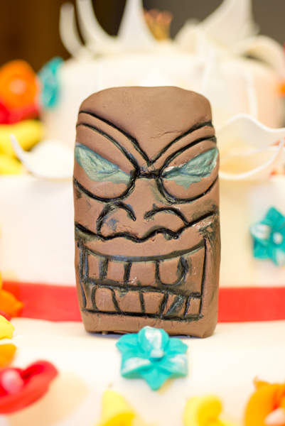 A Tiki mask adorns Persing's cake ...