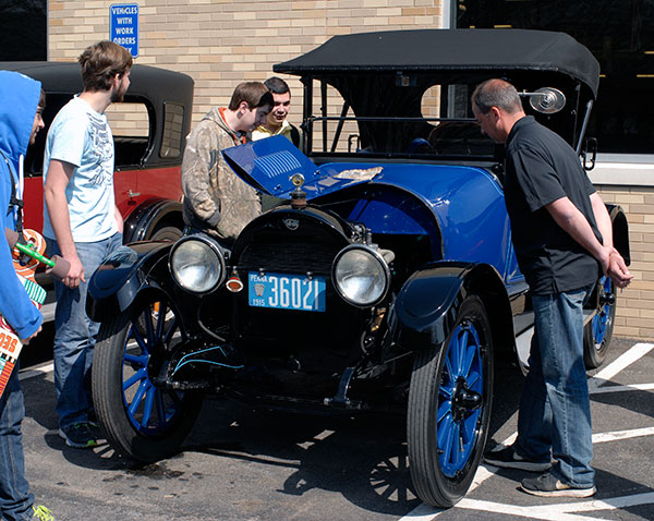 Faculty and students enjoy a Horseless Carriage Car Show outside the Parkes Automotive Technology Center.