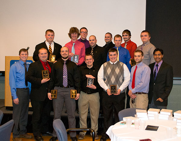 An all-Greek gathering poses a formidable lineup. Among those pictured is Sigma Nu's Tylor J. Burkett (front row, third from left), an aviation maintenance technology major from Middletown, holding awards as 