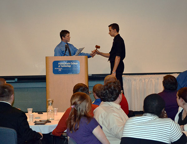 ... being passed from this year's president, Michael L. Spear, to 2014-15 leader Ryan A. Gibson.