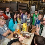 Youngsters learn the art and science of salad preparation from Cody M. Yonkin, a culinary arts technology major from South Williamsport ... 