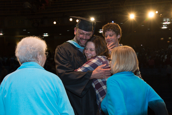 Kruppenbacher receives congratulatory hugs from family members following Friday's ceremony. 