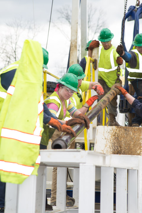 The crew goes about its work ...