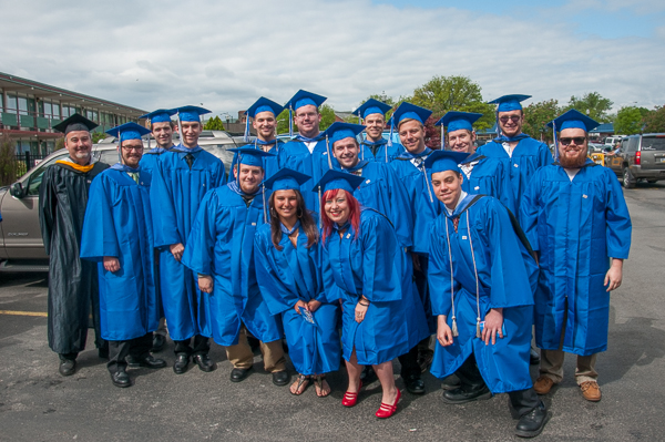 Graduates from the collision repair and restoration majors gather with Roy H. Klinger, instructor of collision repair.