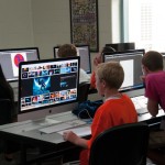 Campers design logos in the Mac lab.