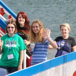 SMART Girls wave from the Hiawatha riverboat.