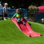 On the toddler side, an embedded slide offers a soft landing.