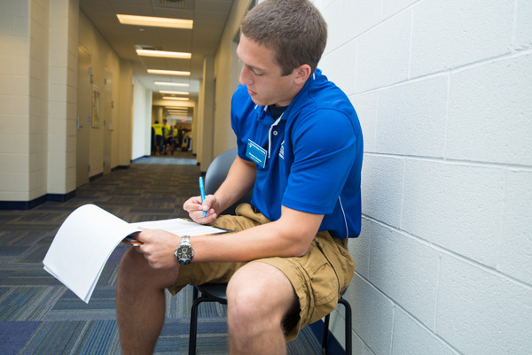 Checking his list (and checking it twice) is Dauphin Hall resident assistant Christian H. Dressler, of Mifflintown, a senior in building automation technology.