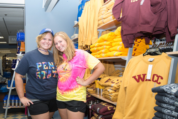 Shopping sisters! Alyssa L. Fink, left, a sophomore in business administration: management concentration from Jersey Shore, and her sister, Jessica, a Jersey Shore Area Senior High School sophomore enrolled in a Penn College NOW course, look for colorful gear in The College Store.<br />
