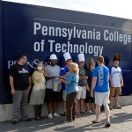 A "bucket brigade" of Student Ambassadors, representing Greek Life, athletics or some of the college's "degrees that work," forms at the main entrance.