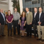 The family and employer of the late Steelyn G. Kanouff, ’07, gather in front of Penn College’s Donor Wall to commemorate Amerikohl Mining’s $1 million scholarship donation in Kanouff’s memory.