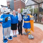 Before the unveiling, the two colleges' mascots and presidents gather for a group photo.