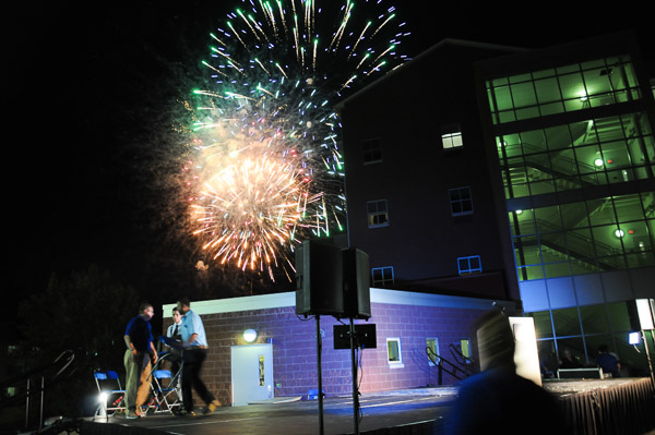 The traditional Welcome Weekend fireworks display lights up the western sky.