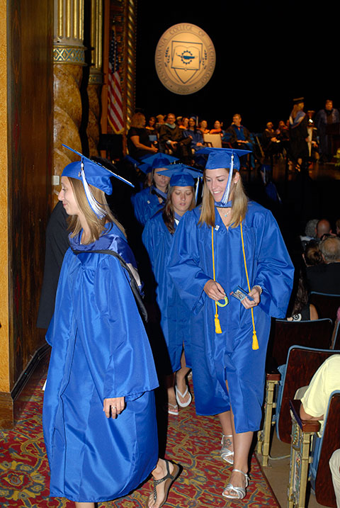 Students move toward a holding area in the wings, awaiting their highly anticipated walk across the CAC stage.