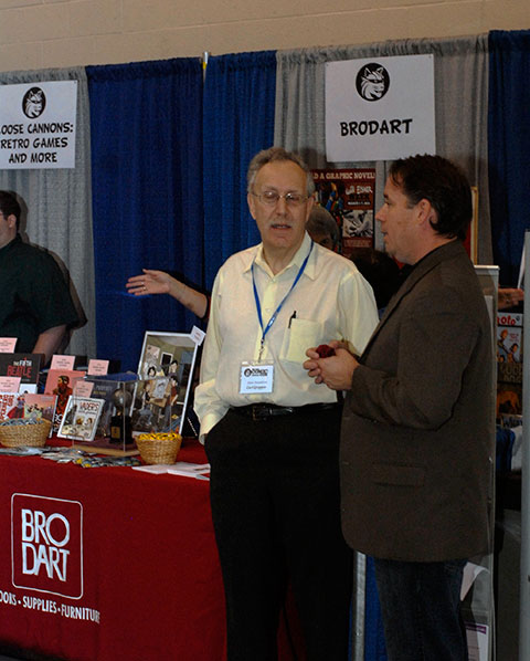 Carl Gropper (left), CEO of the Will Eisner Estate and nephew of the industry legend, greeted visitors to the Brodart display. 