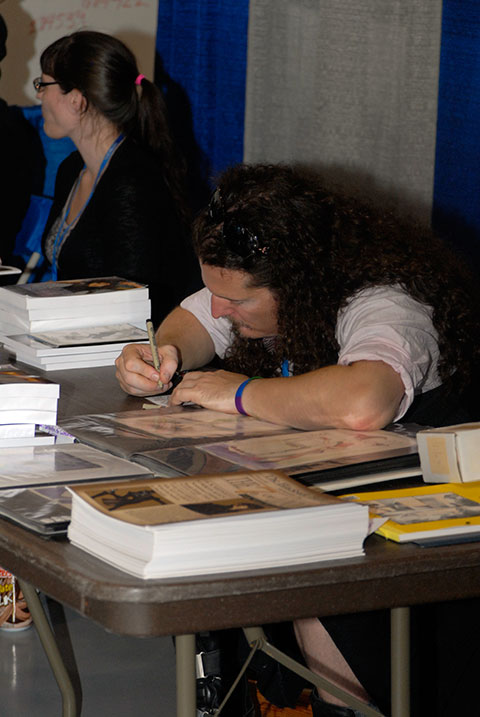 Local artist/author/actor Beau Schemery, of Hed-Bon Studios, gets down to work in Artist Alley.