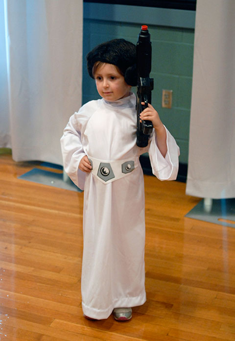 A rebel with a costume, young Princess Leia defends the alliance.