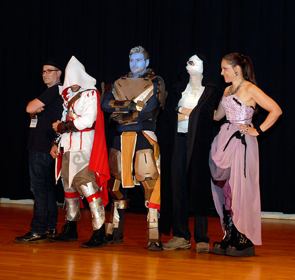 With the contest judges on either side, the adult cosplay winners prepare to take another bow.