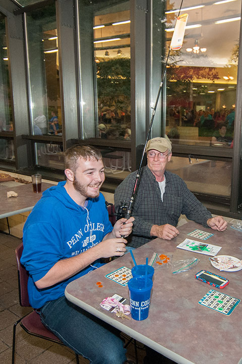 Shane S. Zeigler, a building construction technology student from Horsham, reels in a bingo prize.