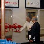 ... and leading a tour of the full-size natural gas wellhead donated to ShaleNET U.S.