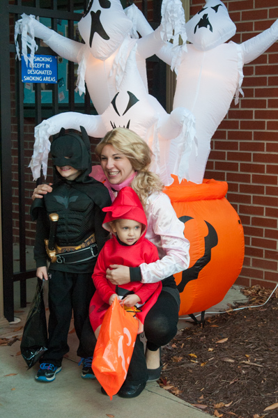 A trio of friendly faces wards off the spooky spirits behind them.