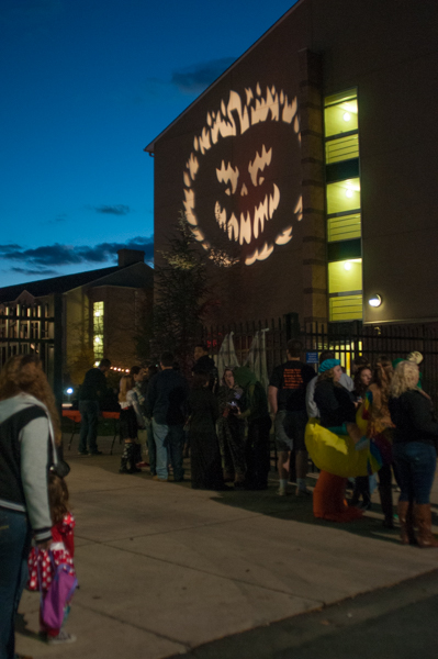 A projected pumpkin lights the way to the Rose Street festivities.