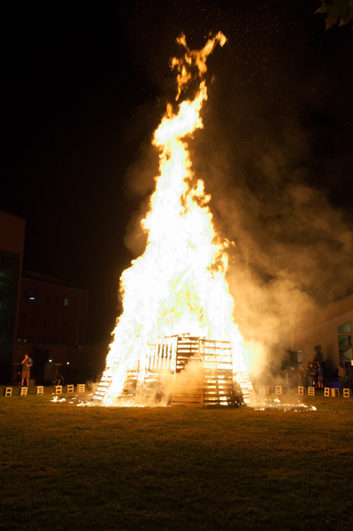 The traditional Homecoming bonfire creates Friday night light near the General Services warehouse.