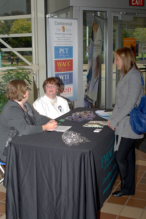 Representatives of Evangelical Community Hospital in Lewisburg, among eight employers at the Health Sciences Career Fair, meet with a student in the ATHS atrium.