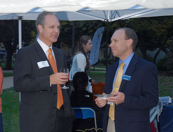 Robb Dietrich (right), executive director of the Penn College Foundation, talks with Keith O. Barrows, a senior vice president at PNC Bank (and former executive director of the Lock Haven University Foundation).