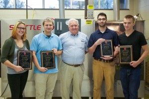Pennsylvania College of Technology plastics and polymer engineering technology students receive plaques, recognizing their research presented earlier this year at a rotational molding forum in Cleveland, Ohio. From left are:  Julia I. Gilchrist, of Hanover; Thomas J. Ryder, of Muncy; Larry Schneider, representing the Rotational Molding Division of the Society of Plastics Engineers; Benjamin G. Robertson, of Hummelstown; and Taylor J. Smith, of Williamsport. 