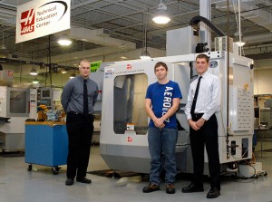From left, Penn College scholarship recipients Austin R. Ayars, of Nazareth; Dakota J. Endress, of Josephine; and Austin R. Schaeffer, of Oley, gather in the Haas Technical Education Center within Penn College's automated manufacturing lab. A fourth recipient, Samuel N. Schwyter, of Williamsport, was absent.