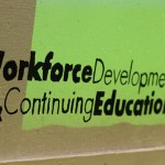 Last season's winner among college employees adds its signature to the department's 2014 card. What will it be THIS year?