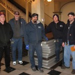 A heads-up crew from a hands-on institution makes quick work of table delivery. From left are Eric W. Huffman and, from the college's General Services staff, Patrick J. Kimble, Jeff G. Rotoli, Breen and Barry L. Loner Jr.