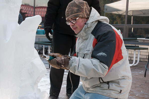 Arthur Carroll adds detail to a fish sculpture.