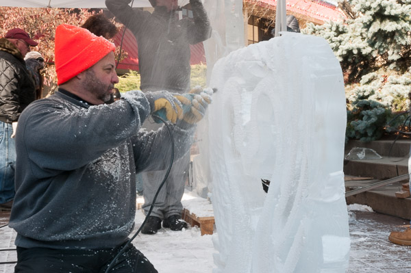 Chef Robert Lo Furno carves details into a pair of swans.