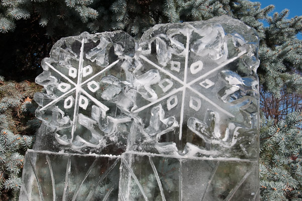 A pair of snowflakes demonstrates relief carving.