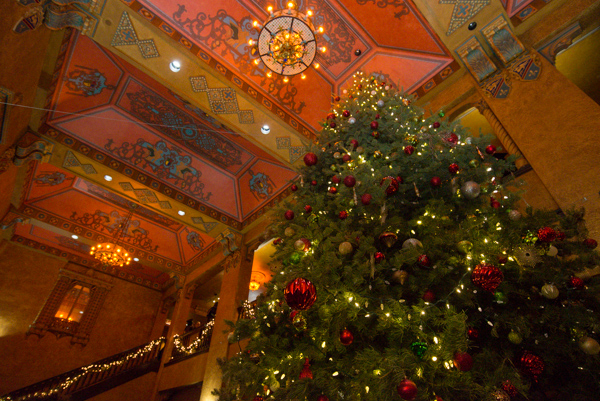 The magnificent Community Arts Center ups the grandeur with a Christmas tree reaching for the ornate ceiling.