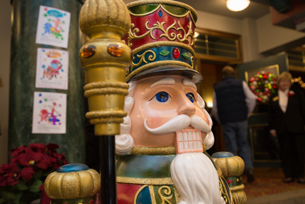 A nutcracker flashes its pearly smile, perhaps in honor of the students' accomplishment.