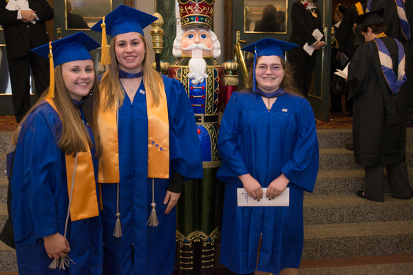 A silent sentinel photobombs School of Business & Hospitality friends.