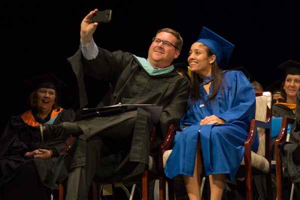 Faculty onlookers share in the joy of the class speaker's splendid day, captured with the help of chief student affairs officer Elliott Strickland.
