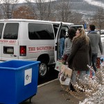 Co-workers in the Student Activities Office help shuttle gift bags to the Salvation Army van ...