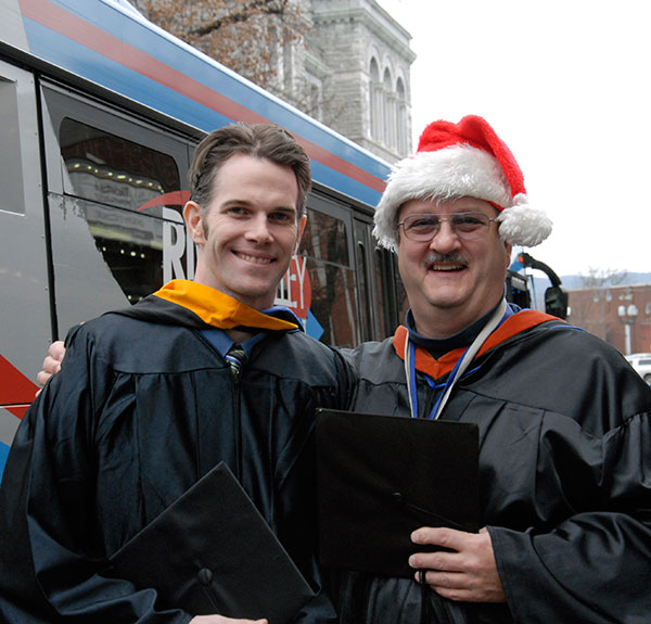 ... and embraces faculty colleague Chef Charles R. Niedermyer II.