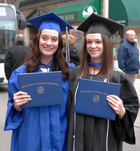 Members of the 2010 South Williamsport Area Jr./Sr. High School class, Kristina M. Williams (left) and Kelsey L. Beard also graduated from college together on Saturday. Williams earned an associate degree in baking and pastry arts and Beard received her bachelor's in nursing. (Williams' twin sister, Emmalee J., is a graphic design major who helped create the Centennial mosaic on the college's main campus.)
