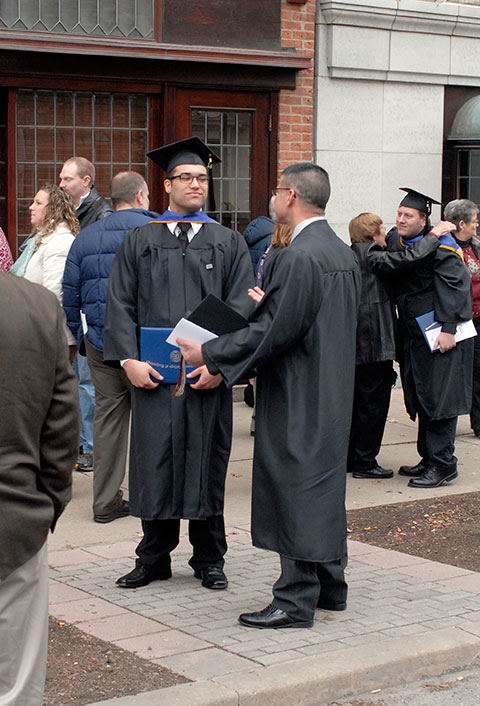 Technology management grad Marco G. Peralta talks with Joseph A. Tavani, a Honda PACT faculty member.