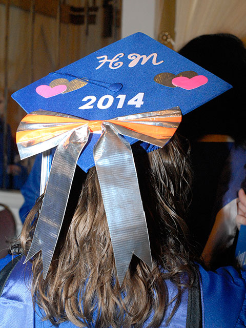 Stephanie G. Dewalt-Gallagher, who graduated in hospitality management, added a shiny duct-tape bow to her regalia.