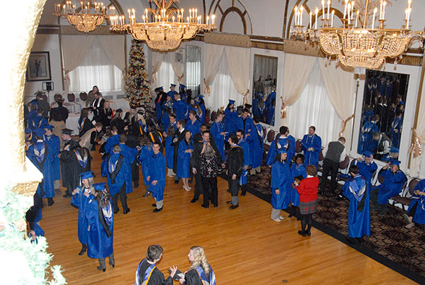 Awaiting marching orders in a seasonally festooned Genetti ballroom