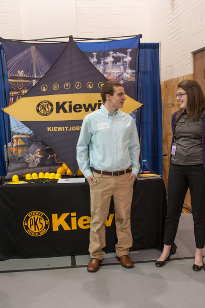 Logan M. Tubiello, an Ottsville resident majoring in welding and fabrication engineering technology, visits with a representative of Kiewit, where he served an internship.