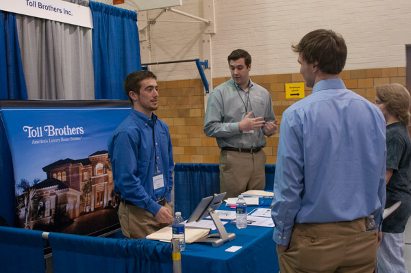 Christopher P. Brennan, a 2014 graduate in residential construction technology and management: building construction technology concentration, talks with former Toll Brothers Inc. intern Mark A. Lapszynski, a residential construction technology and management major from Kennett Square.