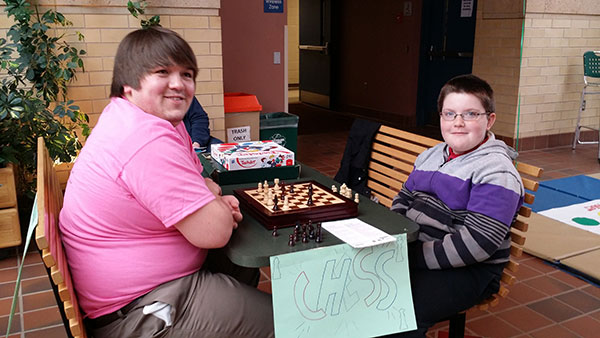 Jan Stephen Winther, of Williamsport, challenges a visitor to a game of chess.